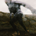 Runner wearing Minimus Lite waterproof running jacket in Lilac Haze